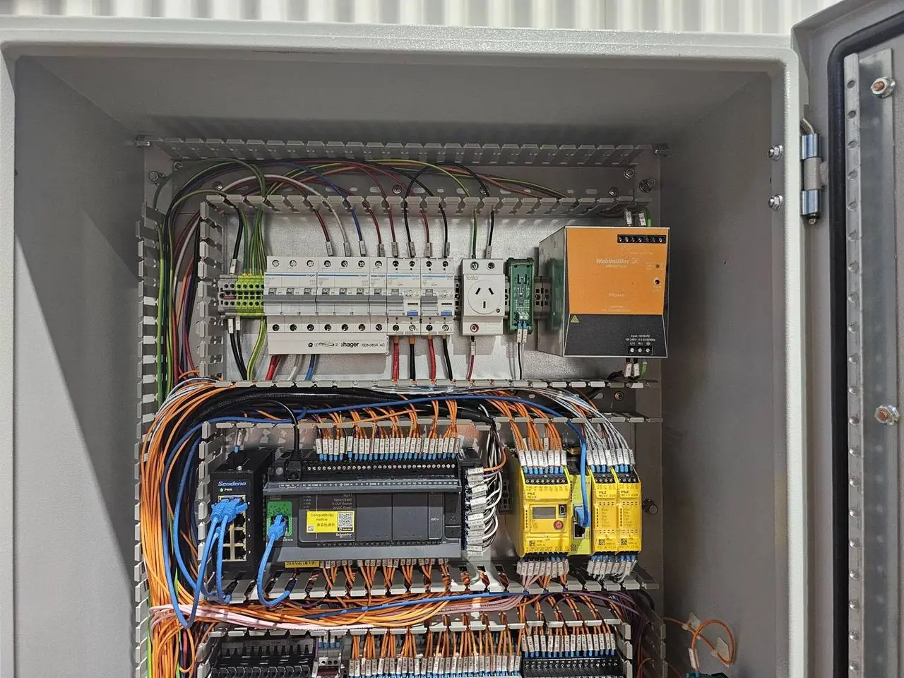 PLC control board with safety relays and terminal wiring