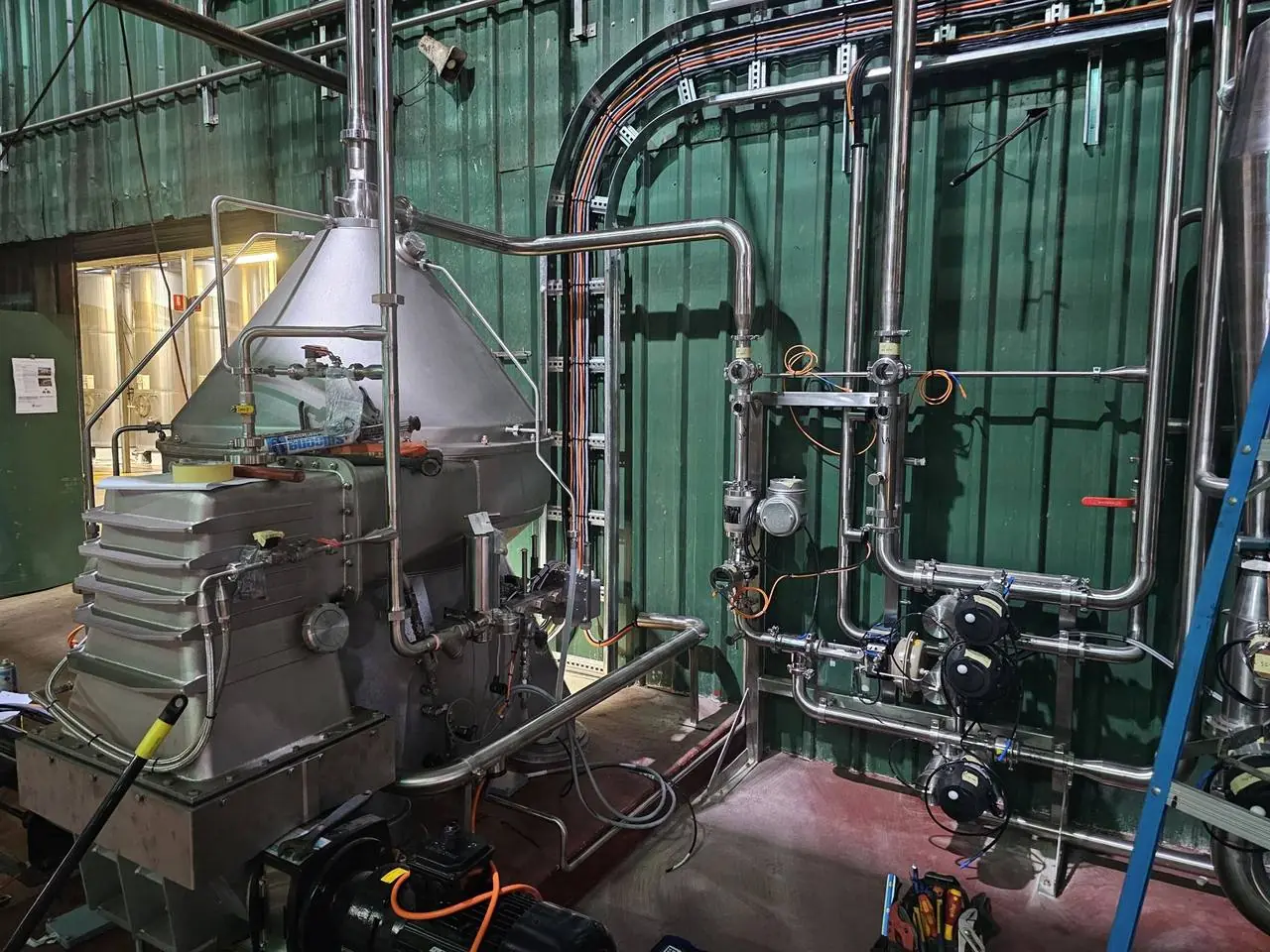 Process plant with stainless pipework and centrifuge